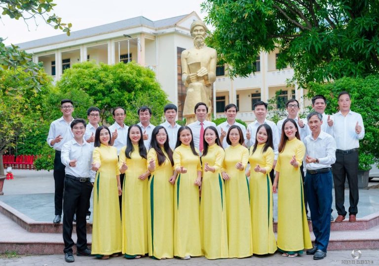 A group of people in yellow dresses Description automatically generated