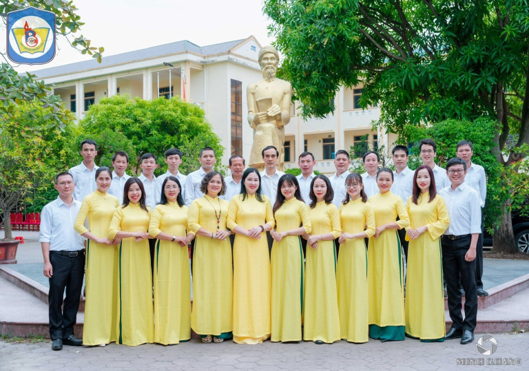 A group of people in yellow dresses Description automatically generated