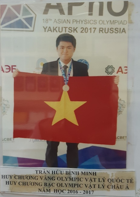 A person holding a red flag with a star

Description automatically generated